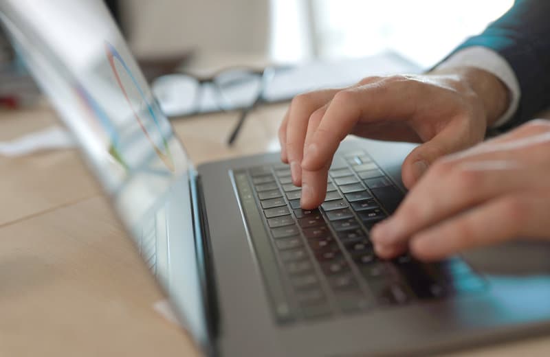 Laptop keyboard representing resume cover letter and LinkedIn review